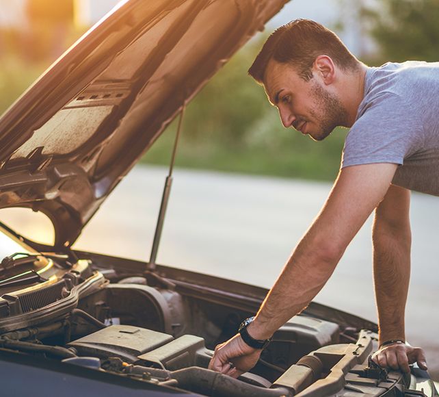 Man looking at engine