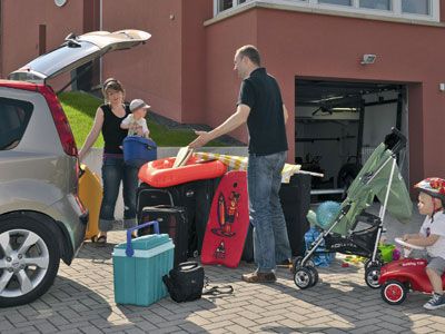 Man and Woman packing car